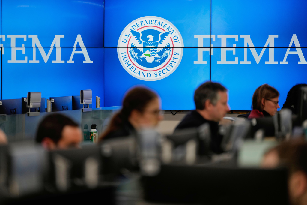 FILE - People work at the Federal Emergency Management Agency headquarters in Washington, on Saturday, Jan. 24, 2026. (AP Photo/Julia Demaree Nikhinson, File)