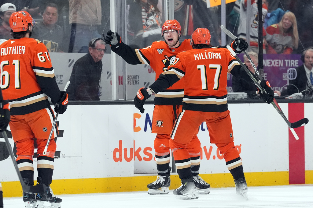 Anaheim Ducks' Beckett Sennecke (45) celebrates his goal against the Vegas Golden Knights with Alex Killorn (17) during the first period of an NHL hockey game, Sunday, May 10, 2026, in Anaheim, Calif. (AP Photo/Scott Strazzante)