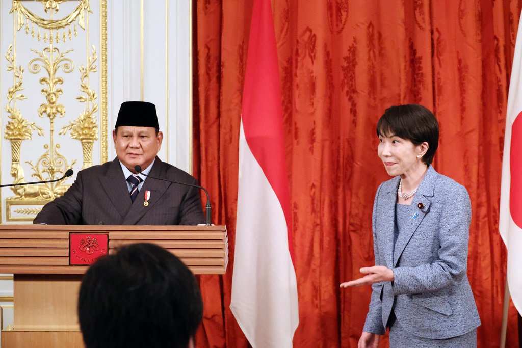 Indonesian President Prabowo Subianto, left, is greeted by Japanese Prime Minister Sanae Takaichi for their lunch after they announced their statements at the Akasaka guesthouse in Tokyo Tuesday, March 31, 2026. (Yoshikazu Tsuno/Pool Photo via AP)