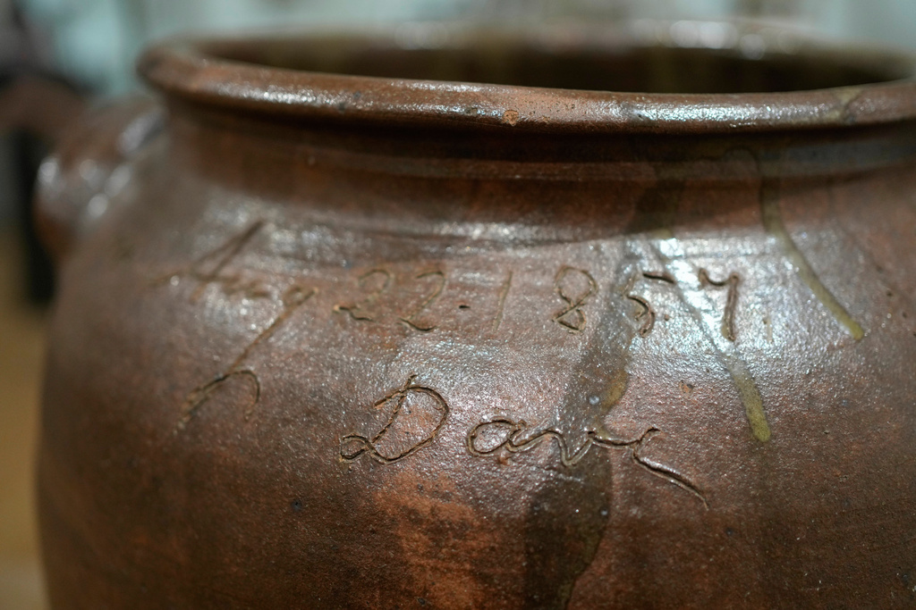 A signed stoneware vessel created by enslaved potter David Drake is seen at the Museum of Fine Arts, Monday, Nov. 10, 2025, in Boston. (AP Photo/Robert F. Bukaty)