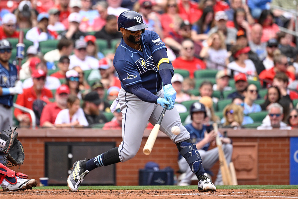 Tampa Bay Rays' Yandy Díaz hits an RBI single in the second inning of a baseball game against the St. Louis Cardinals, Sunday, March 29, 2026, in St. Louis. (AP Photo/Joe Puetz)