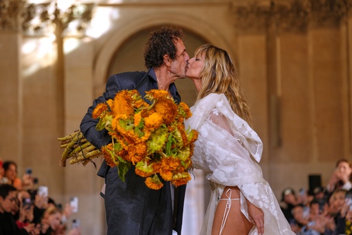 Designer Andreas Kronthaler, left, kisses Heidi Klum after the Vivienne Westwood Spring/Summer 2026 collection presented in Paris, Saturday, Oct. 4, 2025. (AP Photo/Aurelien Morissard) Designer Andreas Kronthaler, left, kisses Heidi Klum after the Vivienne Westwood Spring/Summer 2026 collection presented in Paris, Saturday, Oct. 4, 2025. (AP Photo/Aurelien Morissard)
