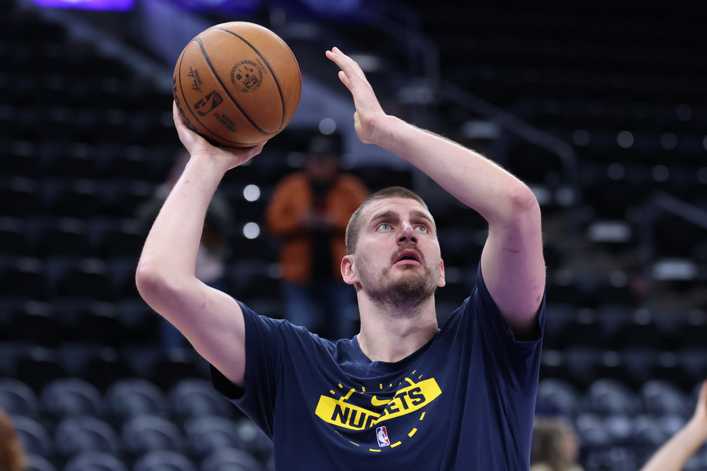 Denver Nuggets center Nikola Jokic warms up before an NBA basketball game against the Utah Jazz, Wednesday, April 1, 2026, in Salt Lake City. (AP Photo/Rob Gray)