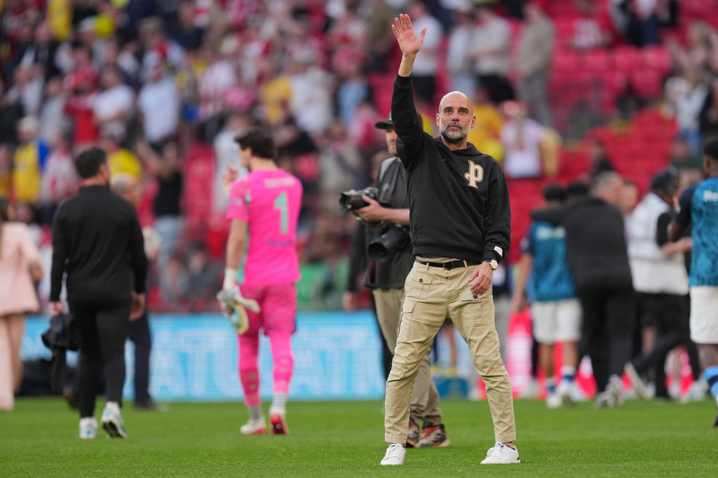 Manchester City's head coach Pep Guardiola reacts after the FA Cup semifinal soccer match between Manchester City and Southampton in Manchester, England, Saturday, April 25, 2026. (AP Photo/Kin Cheung)
