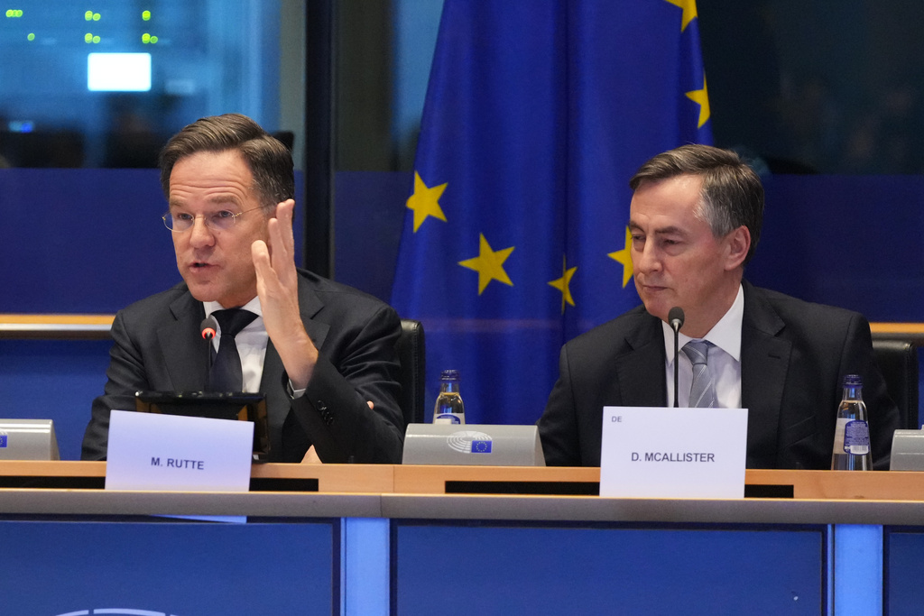 NATO Secretary General Mark Rutte, left, addresses the Security and Defence Committee at the European Parliament in Brussels, Monday, Jan. 26, 2026. (AP Photo/Virginia Mayo)