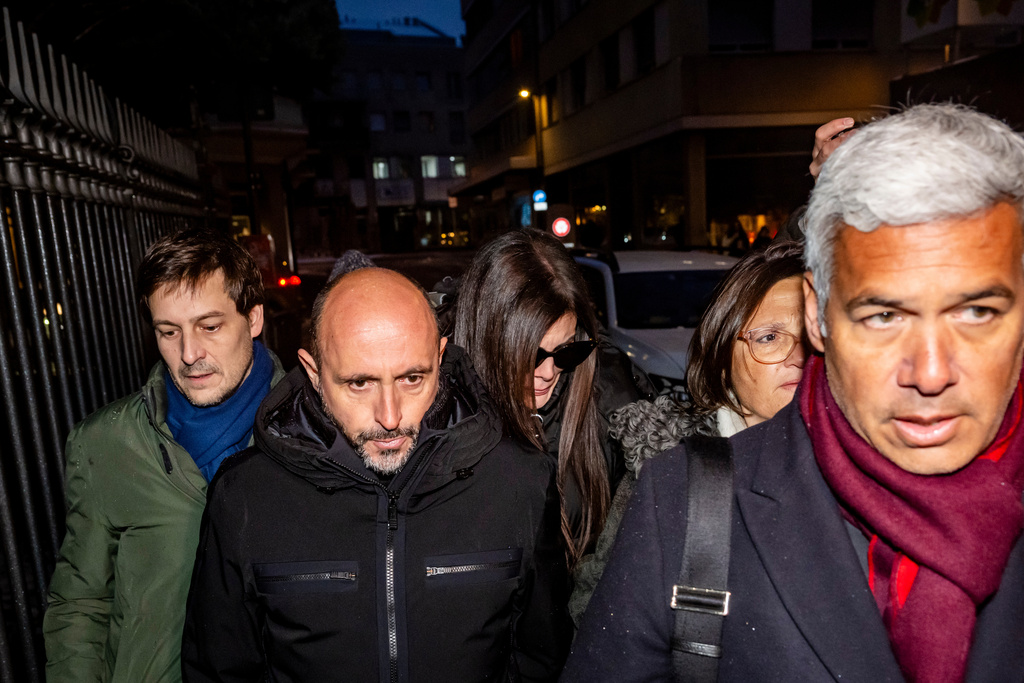 The owners of the "Le Constellation" bar in Crans-Montana, where the deadly fire happened on New Year's Day, Jacques und Jessica Moretti from France, center, arrive with their lawyers Patrick Michod, Yael Hayat and Nicola Meier, to be auditioned by the Valais public prosecutor's office in Sion, Switzerland, Friday, January 9, 2026. (Jean-Christophe Bott/Keystone via AP)