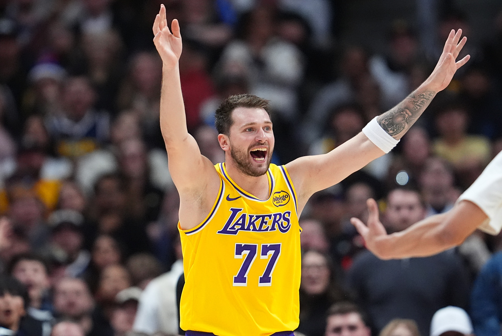 Los Angeles Lakers guard Luka Dončić calls for a review of his shot late in the second half of an NBA basketball game against the Denver Nuggets Thursday, March 5, 2026, in Denver. (AP Photo/David Zalubowski)