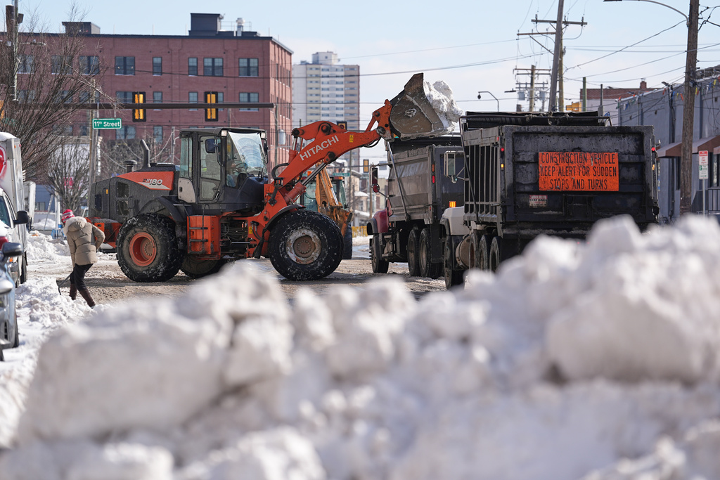 Snow is removed in the aftermath of a winter storm in Philadelphia, Monday, Jan. 26, 2026. (AP Photo/Matt Rourke)