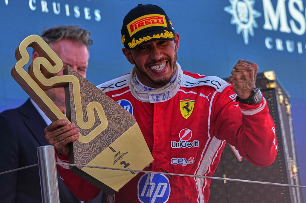 Ferrari driver Lewis Hamilton of Britain celebrates after wining the Spain F1 Grand Prix race at the Barcelona Catalunya racetrack in Montmelo, near Barcelona, Spain, Sunday, June 14, 2026. (AP Photo/Fatima Shbair)