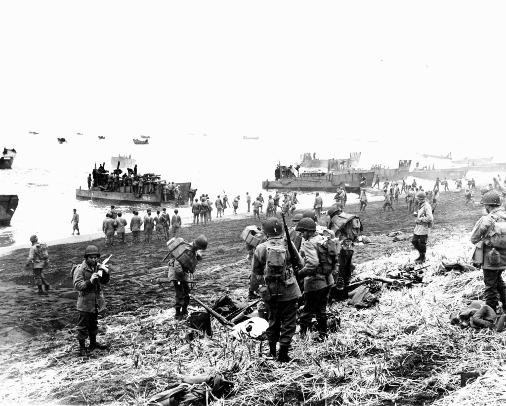 FILE - In this May 26, 1943 file photo released by the U.S. Navy, American soldiers and equipment land on the black volcanic beach during World War II at Massacre Bay on Attu Island, part of the Aleutian Islands of Alaska. (U.S. Navy via AP, File)