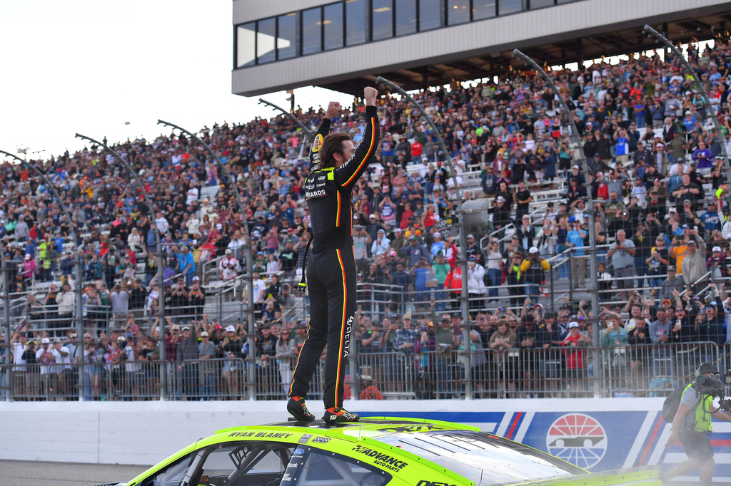 Ryan Blaney stands on his car and gestures to the crowd after winning a NASCAR Cup Series auto race, Sunday, Aug. 23, 2026, at New Hampshire Motor Speedway, in Loudon, N.H. (AP Photo/Steven Senne)