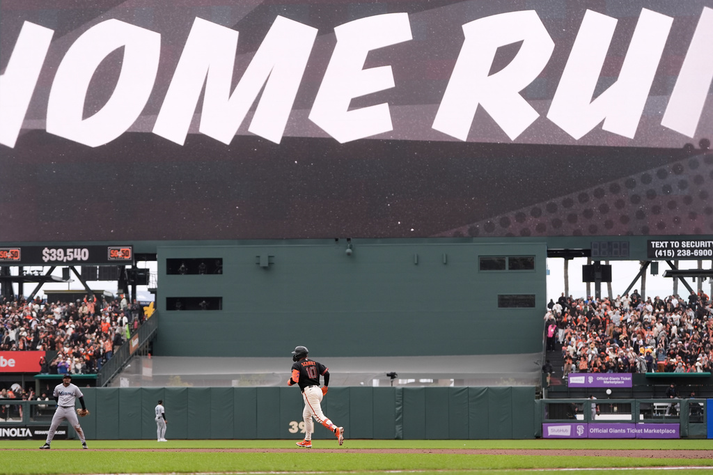 San Francisco Giants' Casey Schmitt (10) runs the bases after hitting a two-run home run during the sixth inning of a baseball game against the Miami Marlins Saturday, April 25, 2026, in San Francisco. (AP Photo/Jeff Chiu)