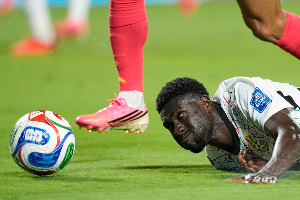 Ghana's Derrick Luckassen (23) falls during the World Cup round of 32 soccer match between Colombia and Ghana in Kansas City, Mo., Friday, July 3, 2026. (AP Photo/Charlie Riedel)