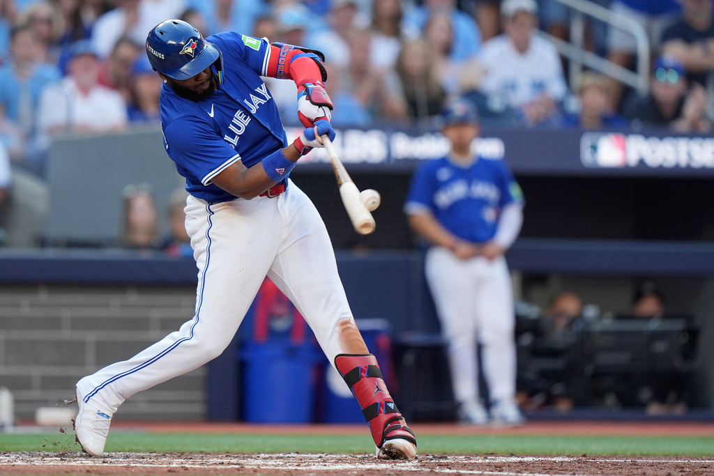 Toronto Blue Jays' Vladimir Guerrero Jr. hits a grand slam against the New York Yankees during the fourth inning of Game 2 of baseball's American League Division Series in Toronto, Sunday, Oct. 5, 2025. (Frank Gunn/The Canadian Press via AP)