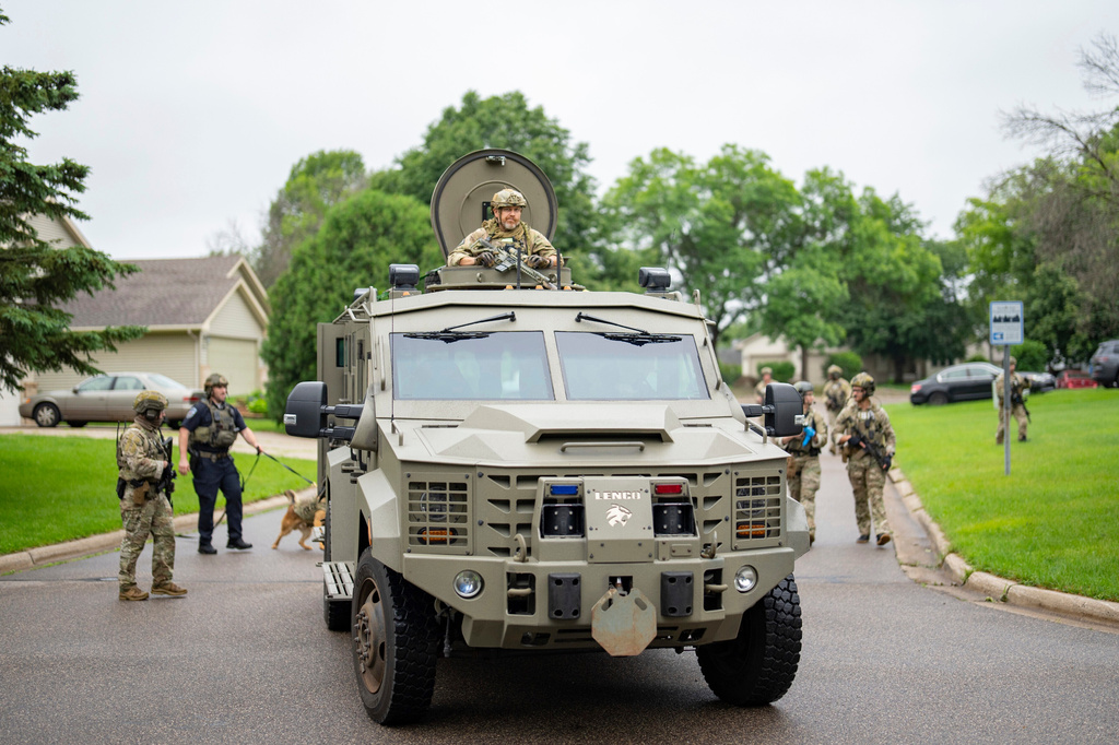 FILE - Armed FBI agents search for an active shooter, sweeping a neighborhood adjacent to the home of Minnesota DFL State Representative Melissa Hortman, in Brooklyn Park, Minn., June 14, 2025. (Alex Kormann/Star Tribune via AP, File)
