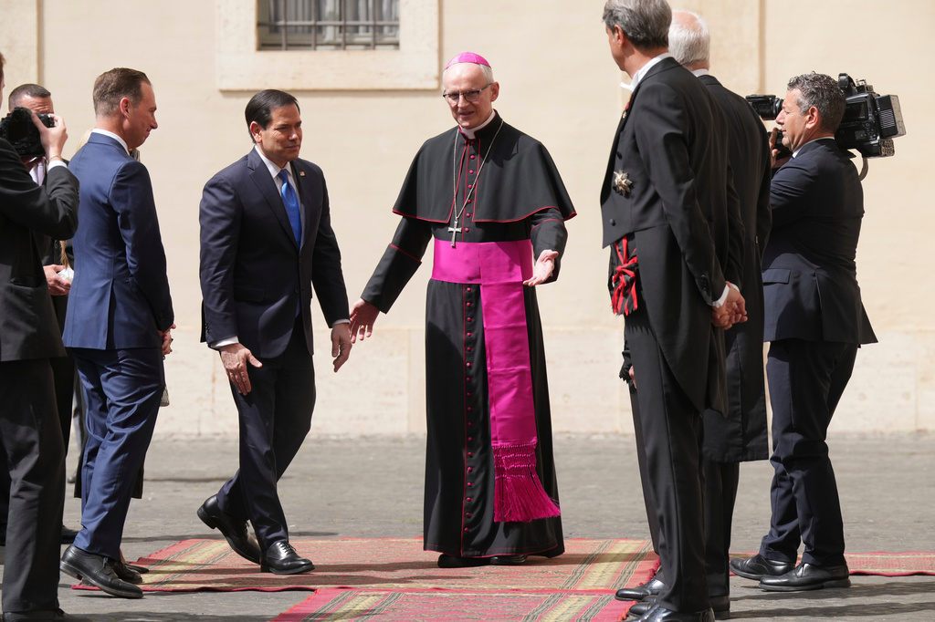 US Secretary of State Marco Rubio is greeted by Archbishop Petar Rajič, the new Prefect of the Papal Householdas as he arrives at the St. Damasus courtyard to meet with Pope Leo XIV and Vatican Secretary of State Pietro Parolin the Vatican, Thursday, May 7, 2026. (AP Photo/Andrew Medichini, Pool)