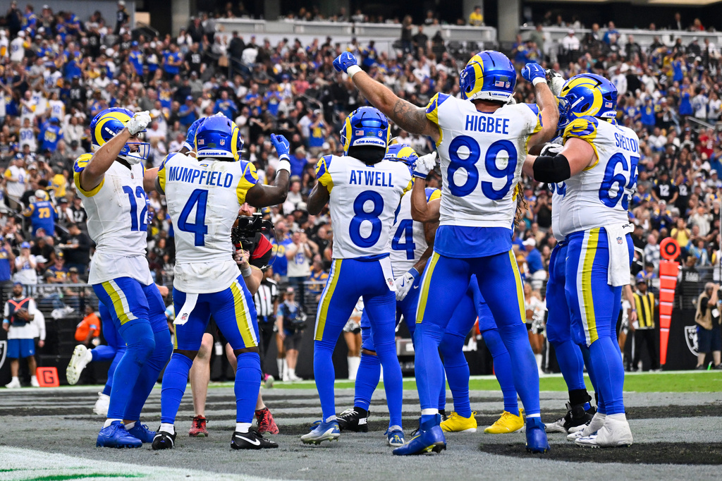 Los Angeles Rams wide receiver Puka Nacua, far left, celebrates after scoring a touchdown with teammates during the first half of an NFL football game against the Las Vegas Raiders, Sunday, Oct. 25, 2026, in Las Vegas. (AP Photo/David Becker)