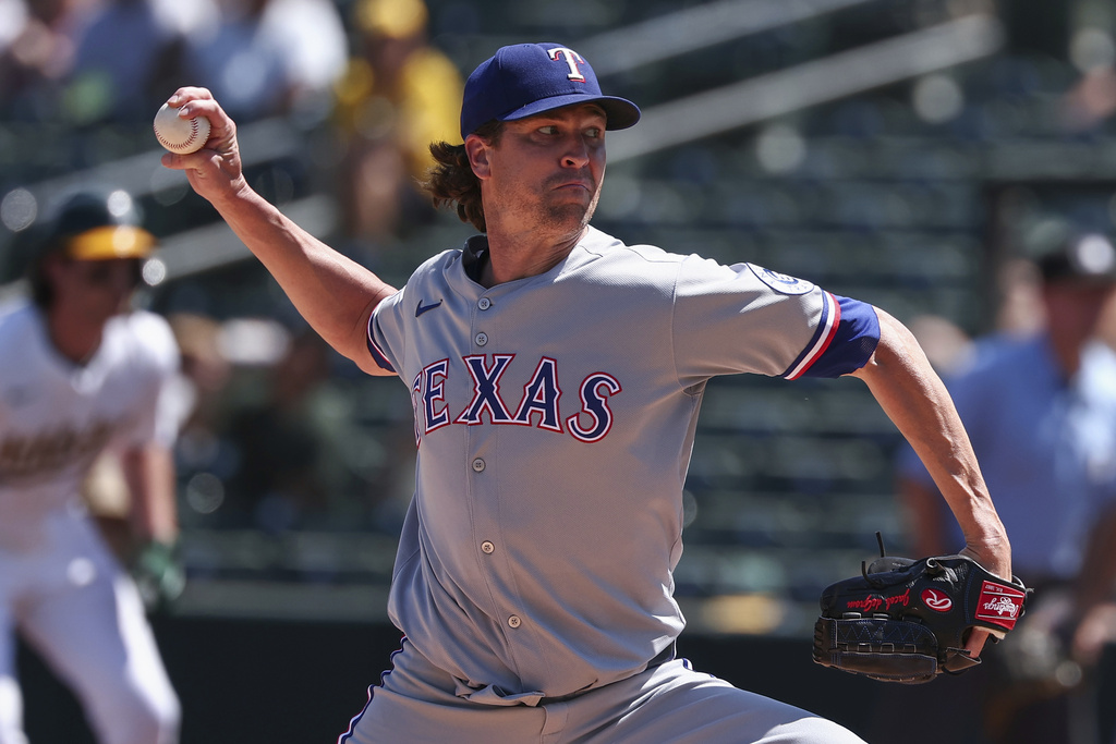 Texas Rangers pitcher Jacob deGrom throws to the Athletics during the first inning of a baseball game Sunday, Aug. 31, 2025, in West Sacramento, Calif. (AP Photo/Sara Nevis)