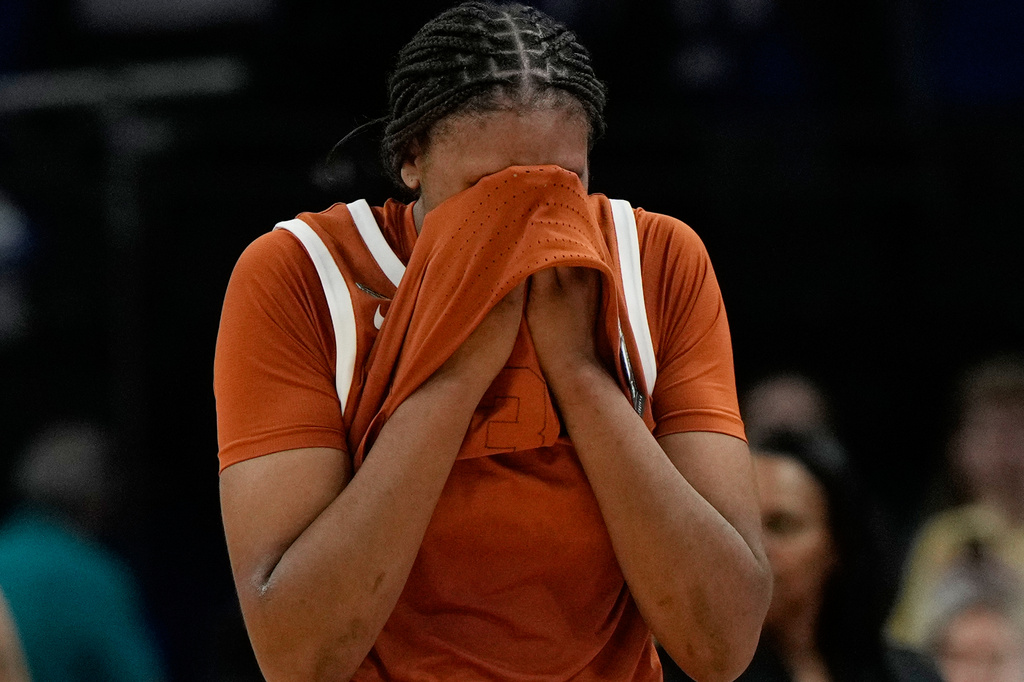 Texas forward Madison Booker (35) reacts after Texas lost to UCLA in a women's NCAA college basketball tournament semifinal game at the Final Four, Friday, April 3, 2026, in Phoenix. (AP Photo/Ross D. Franklin)