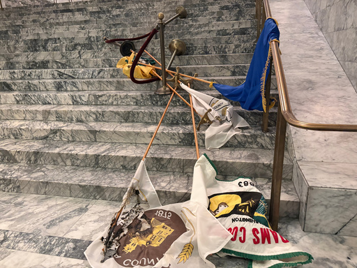 In this undated photo provided by the Department of Enterprise Services, a Washington state government agency, county flags sit burned on marble steps inside the capitol in Olympia, Wash., after an intruder broke in and vandalized the Legislative building on the evening of Oct. 5, 2025. (Department of Enterprise Services via AP) In this undated photo provided by the Department of Enterprise Services, a Washington state government agency, county flags sit burned on marble steps inside the capitol in Olympia, Wash., after an intruder broke in and vandalized the Legislative building on the evening of Oct. 5, 2025. (Department of Enterprise Services via AP)