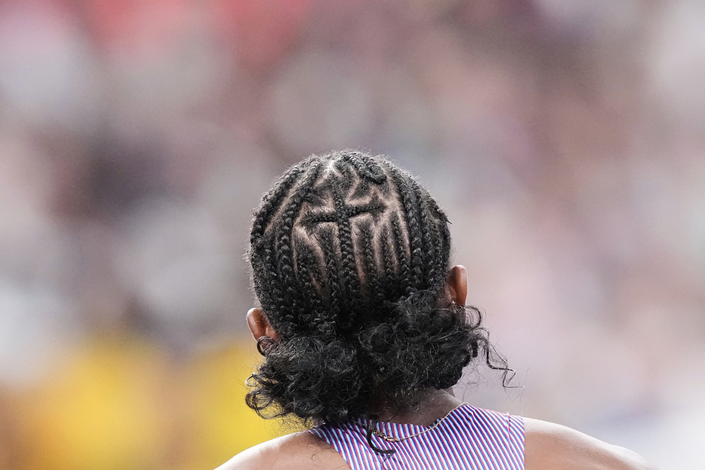 The hair of United States' Melissa Jefferson-Wooden as she competes in the women's 100 meters semifinal heat at the World Athletics Championships in Tokyo, Sunday, Sept. 14, 2025. (AP Photo/Eugene Hoshiko)