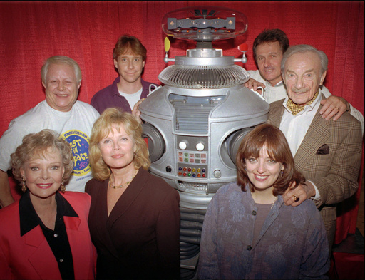 FILE - In this file photo showing the crew from the original cast of the television series "Lost in Space" from left in the back row are: Bob May, Bill Mumy, Mark Goddard, Jonathan Harris; in the front row from left: June Lockhart, Marta Kristen, Angela Cartwright in Boston on Dec. 2, 1995. (AP Photo/Steven Senne, File) FILE - In this file photo showing the crew from the original cast of the television series "Lost in Space" from left in the back row are: Bob May, Bill Mumy, Mark Goddard, Jonathan Harris; in the front row from left: June Lockhart, Marta Kristen, Angela Cartwright in Boston on Dec. 2, 1995. (AP Photo/Steven Senne, File)