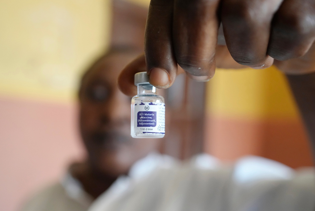 FILE - A health worker shows a bottle of the malaria vaccine R21/Matrix-M before administering it to a child at the comprehensive Health Centre in Agudama-Epie, in Yenagoa, Nigeria, on Dec. 9, 2024. (AP Photo/Sunday Alamba, File)