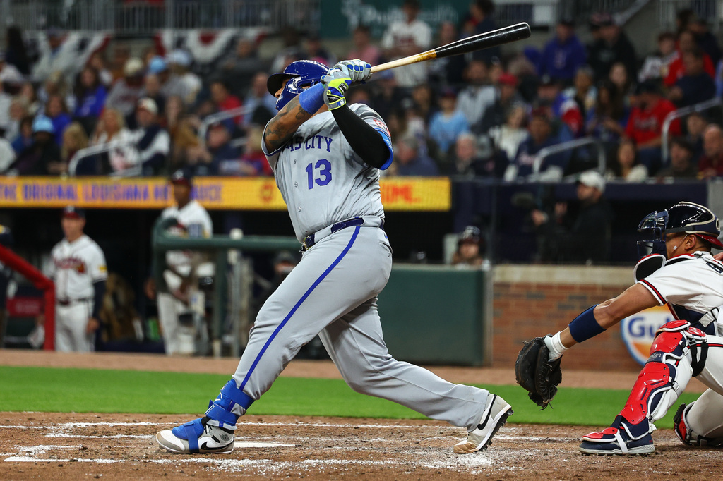 Kansas City Royals' Salvador Perez (13) hits a solo home run in the seventh inning of a baseball game against the Atlanta Braves, Saturday, March 28, 2026, in Atlanta. (AP Photo/Colin Hubbard)
