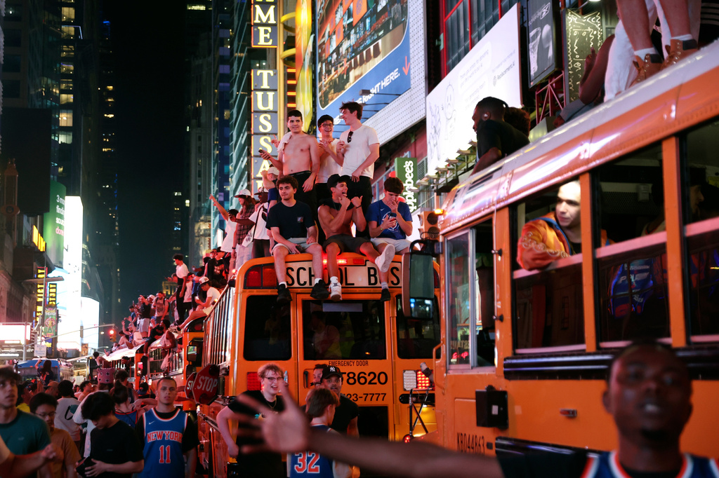 New York Knicks fans celebrate their victory after Game 5 of the NBA Finals basketball series against the San Antonio Spurs, Saturday, June 13, 2026, in New York. (AP Photo/Heather Khalifa)