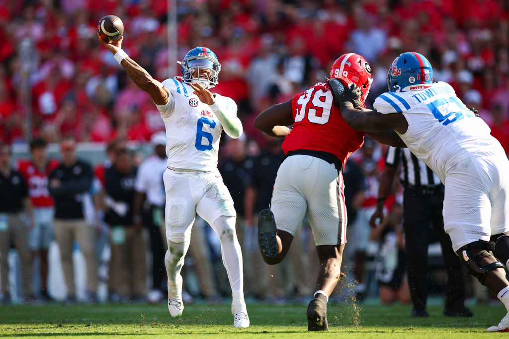 Mississippi quarterback Trinidad Chambliss (6) throws a pass during the first half of an NCAA college football game against Georgia, Saturday, Oct. 18, 2025, in Athens, Ga. (AP Photo/Colin Hubbard)