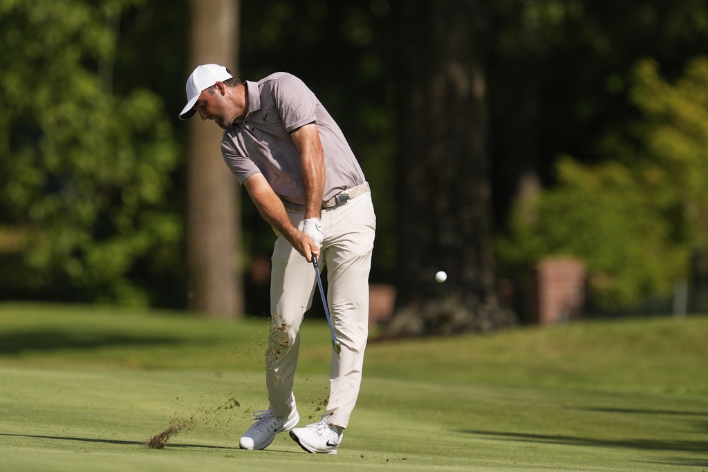 Scottie Scheffler hits from the 16th fairway during the final round of the St. Jude Championship golf tournament Sunday, Aug. 10, 2025, in Memphis, Tenn. (AP Photo/George Walker IV)