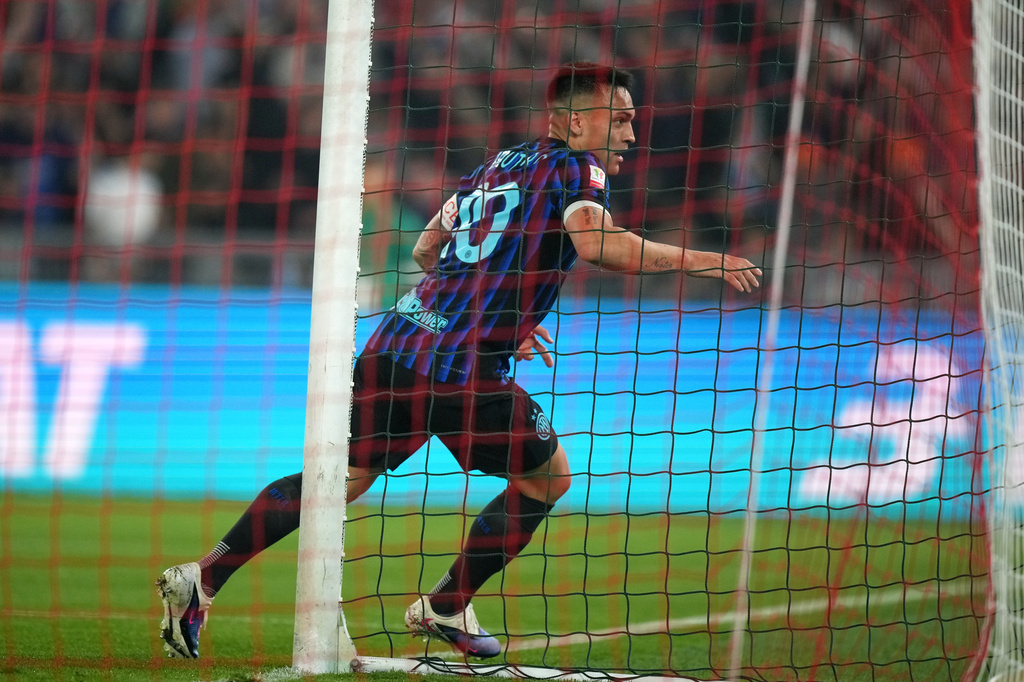 Inter Milan's Lautaro Martinez celebrates after scoring his side's second goal during the Italian Cup soccer final between Lazio and Inter Milan, in Rome, Wednesday, May 13, 2026. (AP Photo/Andrew Medichini)