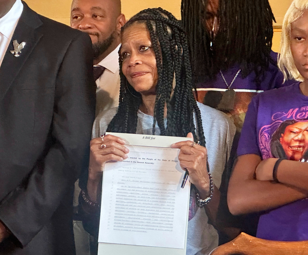 Donna Massey, mother of Sonya Massey, listens to Gov. JB Pritzker speak to reporters in the state Capitol, Tuesday, Aug. 12, 2025, in Springfield, Ili. (John O'Connor/AP)
