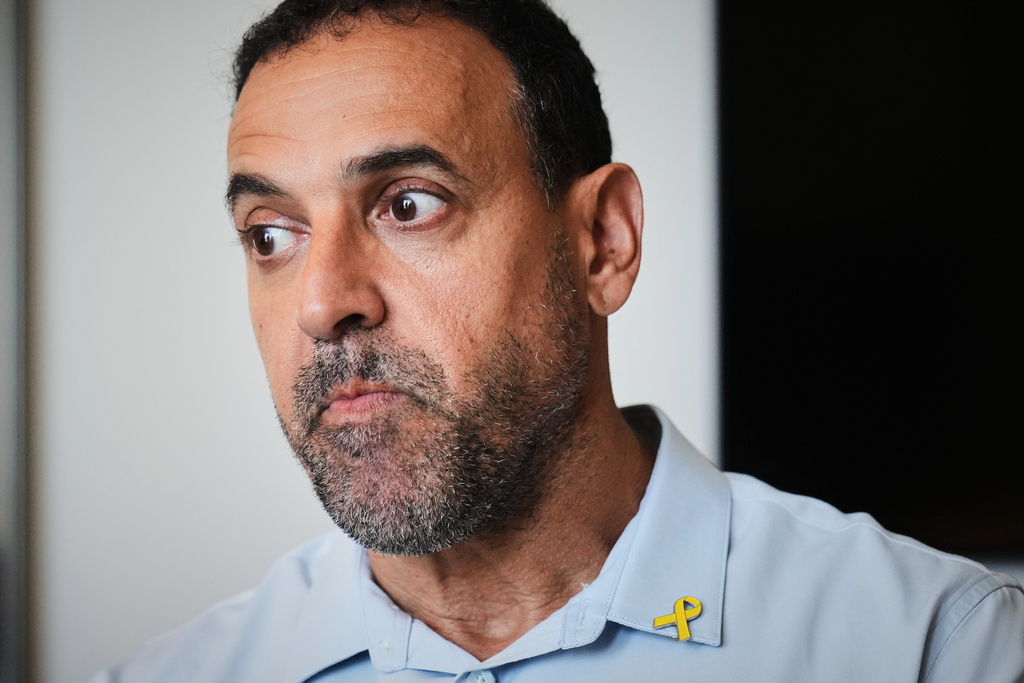 Eli Sharabi, who was abducted during the cross-border attack on Israel on Oct. 7, 2023, and held hostage by Hamas for 16 months, poses for a photo in Herzliya, Israel, Thursday, Sept. 18, 2025. (AP Photo/Ariel Schalit)