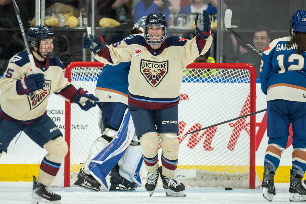 Montreal Victoire's Hayley Scamurra (16) celebrates her goal against the Vancouver Goldeneyes during the third period of a PWHL hockey game, in Vancouver, on Tuesday, April 21, 2026. (Ethan Cairns/The Canadian Press via AP)
