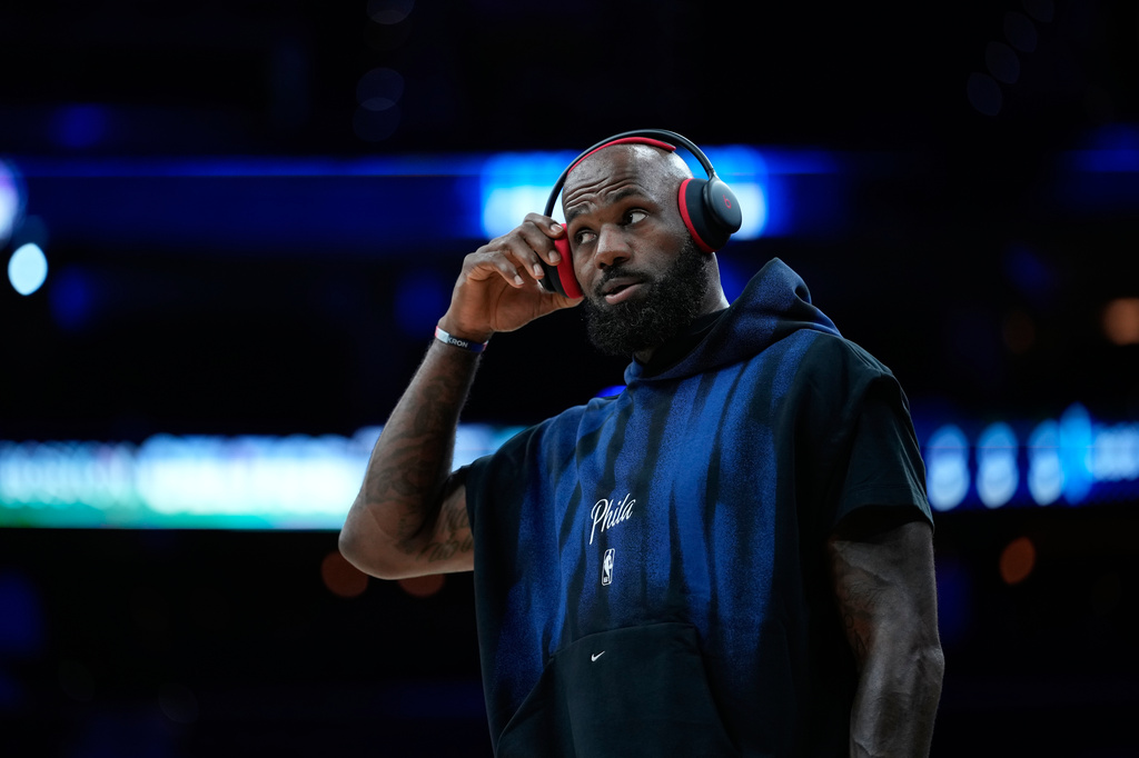 Philadelphia 76ers' LeBron James warms up before a preseason NBA basketball game against the Boston Celtics Friday, Oct. 16, 2026, in Philadelphia. (AP Photo/Matt Slocum)
