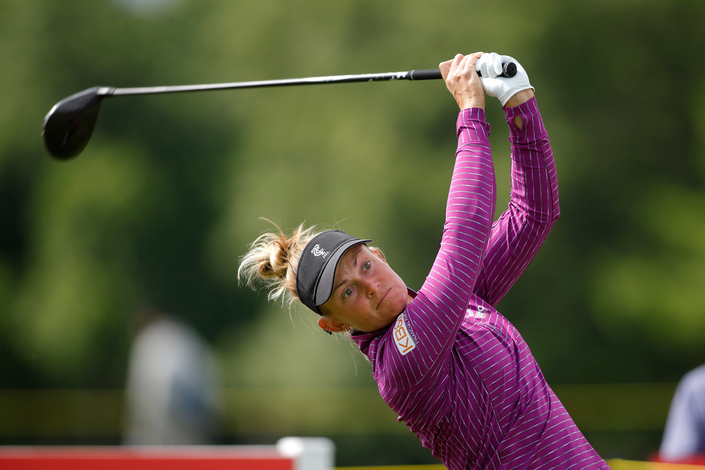 Jessica Porvasnik watches her tee shot on the ninth hole during the first round of the Meijer LPGA Classic golf tournament, Thursday, June 18, 2026, in Belmont, Mich. (AP Photo/Al Goldis)