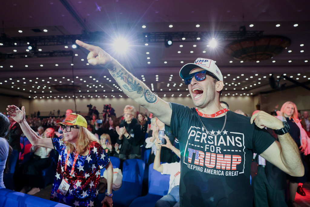 Attendees cheer as White House Border Czar Tom Homan exits the stage during Conservative Political Action Committee at Gaylord Texan Resort and Conference Center, Thursday, March 26, 2026, in Grapevine, Texas. (Shafkat Anowar/The Dallas Morning News via AP)
