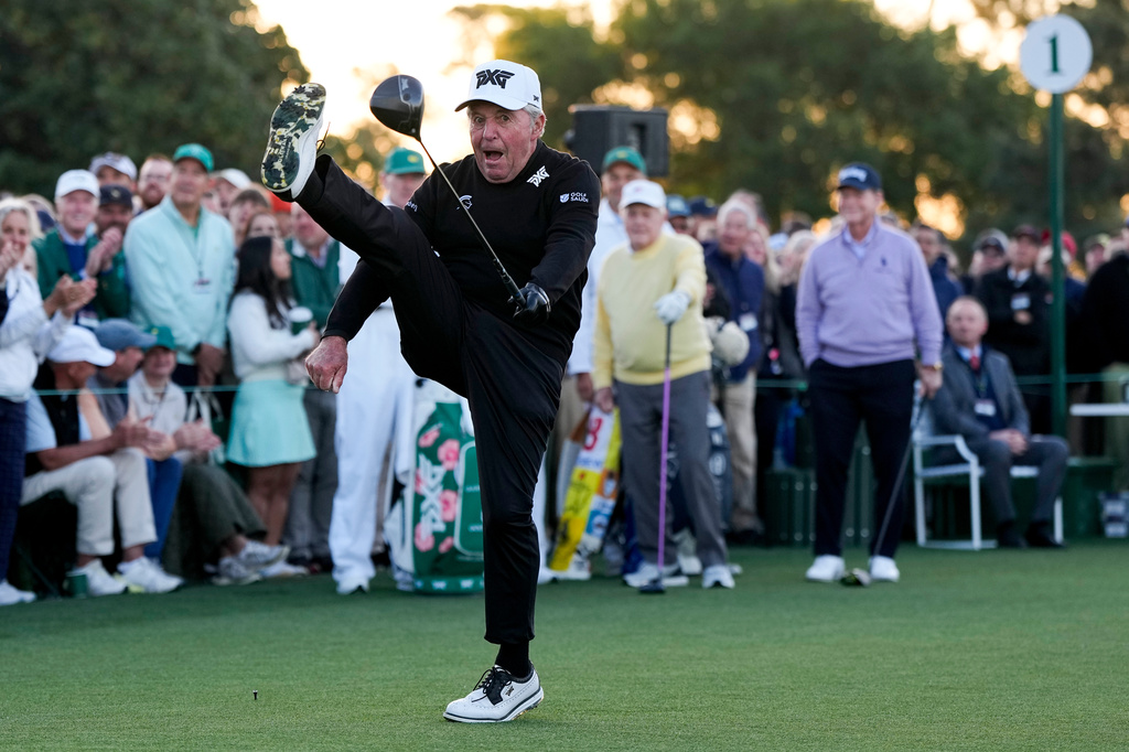 Gary Player kicks his leg in the air after hitting the ceremonial tee shot on the first hole during the first round of the Masters golf tournament at the Augusta National Golf Club, Thursday, April 9, 2026, in Augusta, Ga. (AP Photo/David J. Phillip)