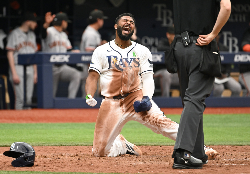 Tampa Bay Rays' Junior Caminero celebrates after scoring during the eighth inning of a baseball game against the San Francisco Giants, Sunday, May 3, 2026, in St. Petersburg, Fla. (AP Photo/Jason Behnken)