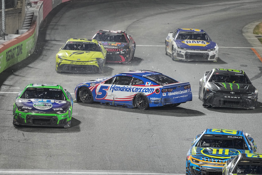 Kyle Busch (8) and Ty Gibbs (54) avoid Kyle Larson (5) spinning out during NASCAR's The Clash preseason auto race, Wednesday, Feb. 4, 2026, in Winston-Salem, N.C. (AP Photo/Matt Kelley)