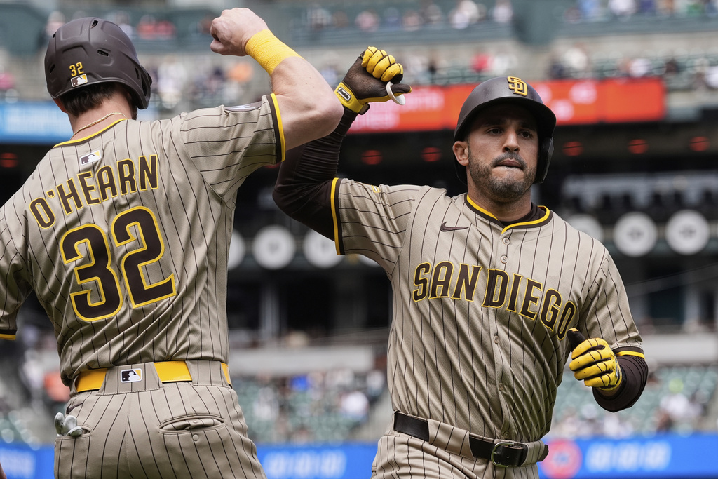 San Diego Padres' Ramón Laureano, right, celebrates with Ryan O'Hearn after hitting a two-run home run during the fifth inning of a baseball game against the San Francisco Giants, Wednesday, Aug. 13, 2025, in San Francisco. (AP Photo/Godofredo A. Vásquez)