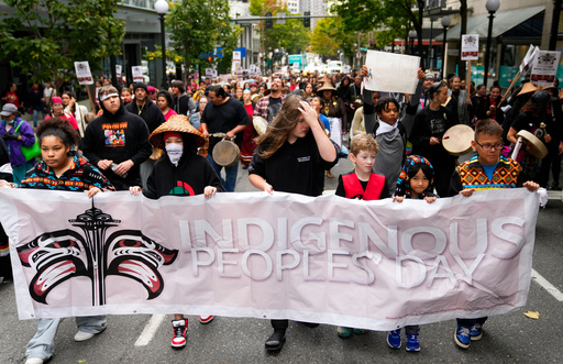 FILE - Youth hold a banner as they lead a celebratory march for Indigenous Peoples Day, Monday, Oct. 9, 2023, in Seattle. (AP Photo/Lindsey Wasson, file) FILE - Youth hold a banner as they lead a celebratory march for Indigenous Peoples Day, Monday, Oct. 9, 2023, in Seattle. (AP Photo/Lindsey Wasson, file)