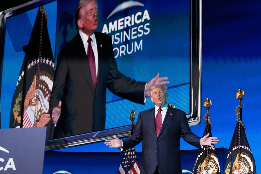 President Donald Trump arrives to speak to the America Business Forum Miami, at the Kaseya Center, Wednesday, Nov. 5, 2025, in Miami. (AP Photo/Jacquelyn Martin)