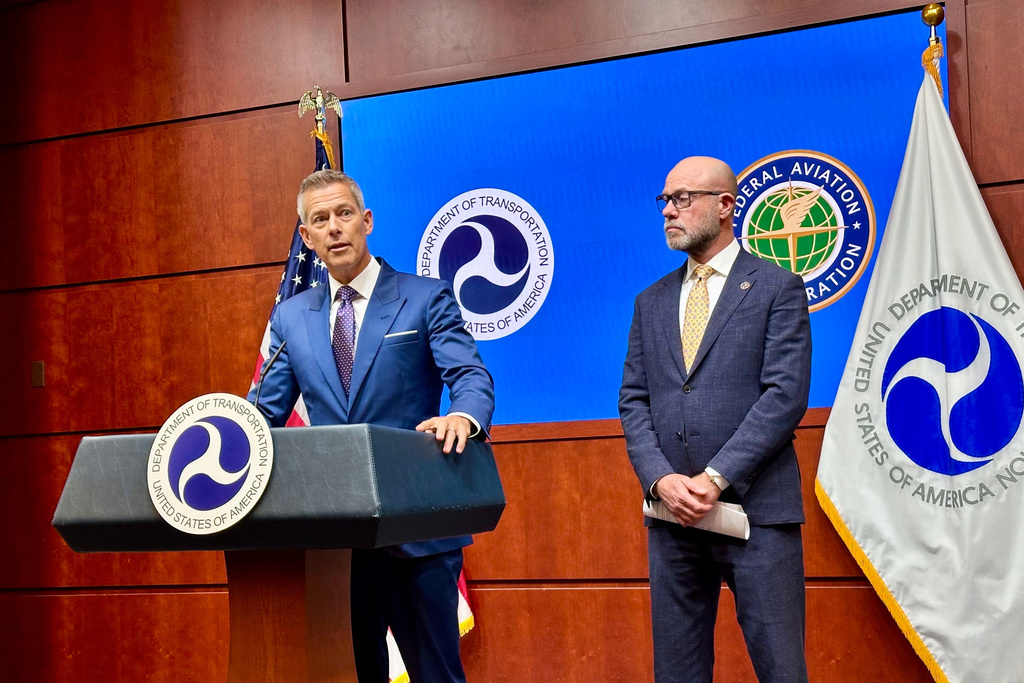 Transportation Secretary Sean Duffy, left, speaks at a news conference with FAA administrator Bryan Bedford to announce flight cancellations across the country because of the government shutdown Wednesday, Nov. 5, 2025 at the U.S. Department of Transportation headquarters in Washington. (AP Photo/Matthew Daly)