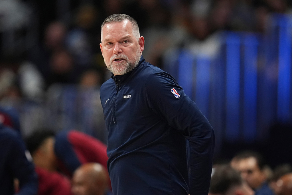 FILE - Denver Nuggets head coach Michael Malone stands on the sideline during the second half of an NBA basketball game April 1, 2025, in Denver. (AP Photo/David Zalubowski, File)