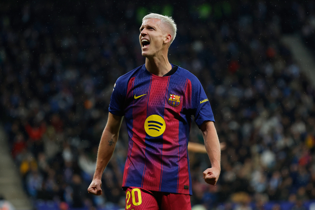 Barcelona's Dani Olmo celebrates scoring his side's opening goal during the Spanish La Liga soccer match between RCD Espanyol and Barcelona in Barcelona, Spain, Saturday, Jan. 3, 2026. (AP Photo/Joan Monfort)