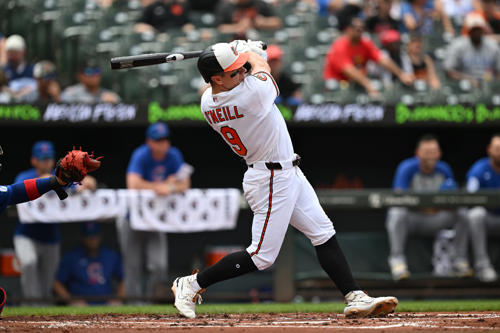 Baltimore Orioles right fielder Tyler O'Neill (9) follows through on a solo home run against the Chicago Cubs in the second inning of a baseball game, Thursday, July 9, 2026 in Baltimore. (AP Photo/Gail Burton)