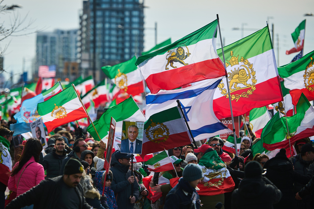 Protesters march in support of regime change in Iran during a demonstration in Richmond Hill, Ont., Saturday, Feb. 28, 2026. (Sammy Kogan/The Canadian Press via AP)