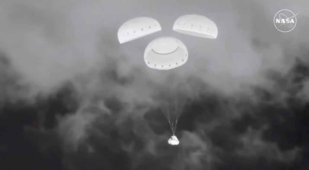 FILE - In this image from video provided by NASA, the empty Boeing Starliner capsule floats down towards White Sands Missile Range in New Mexico late Sept. 6, 2024, after undocking from the International Space Station. (NASA via AP, File)